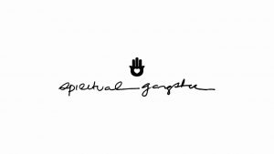 A minimalistic logo featuring a hand symbol above the phrase "spiritual gangster" written in cursive.