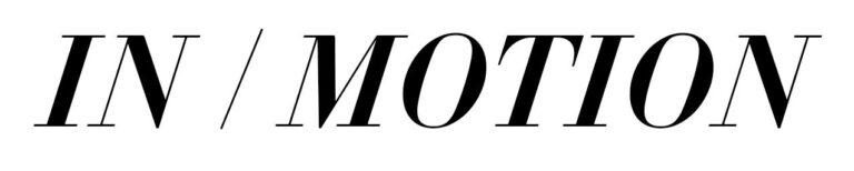 Text logo "in / motion" in black capital letters with a forward slash separating the words, using a bold, sans-serif font.